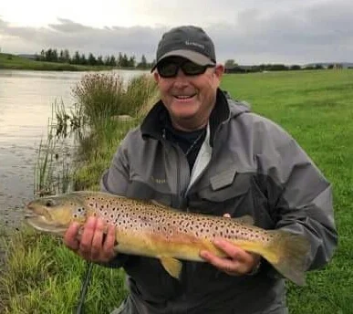 Peter Davison with 7lb Chatton brown trout.