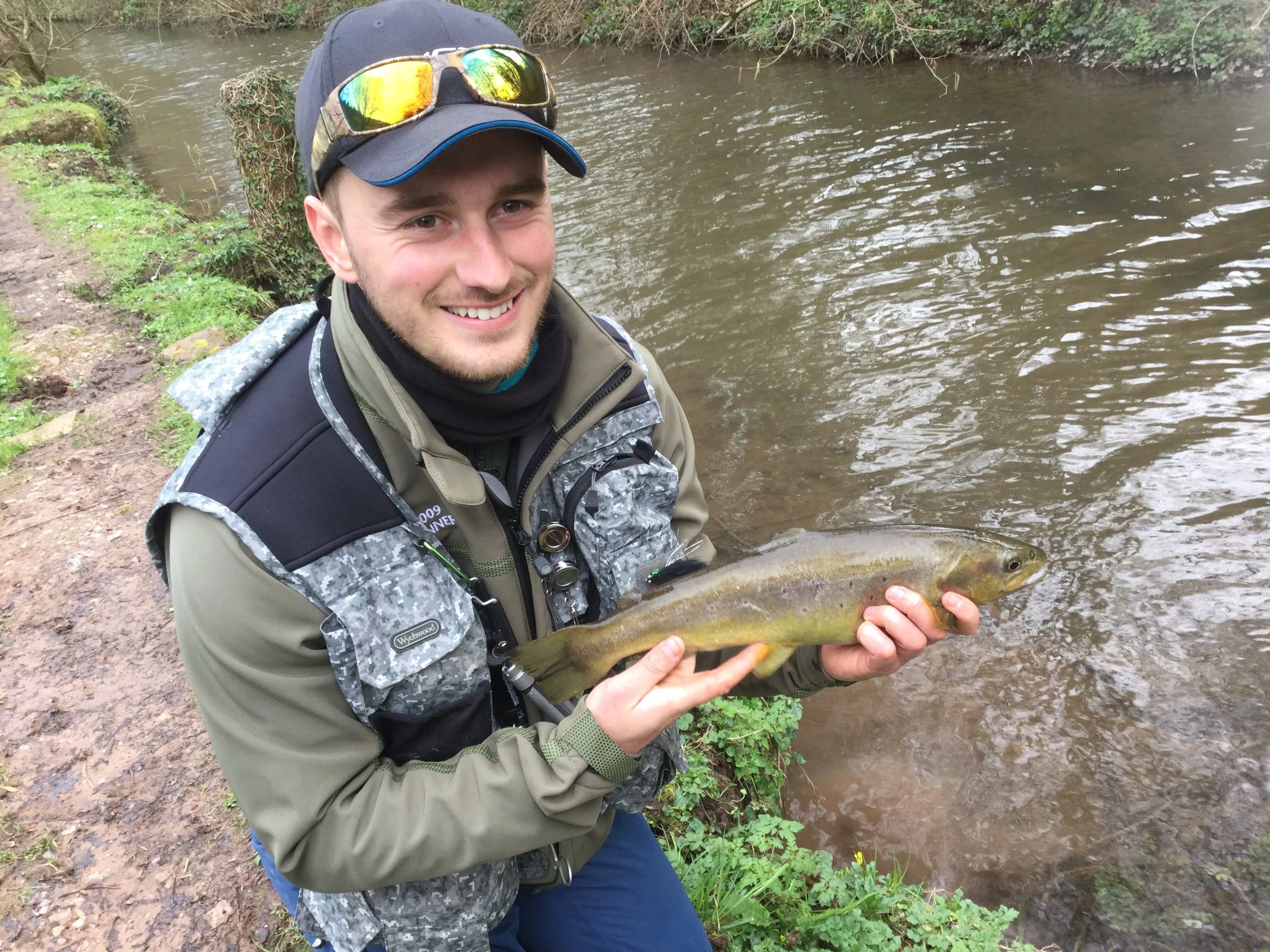 Adam Price-Hunt with the brown trout caught from Bigwell’s stream.