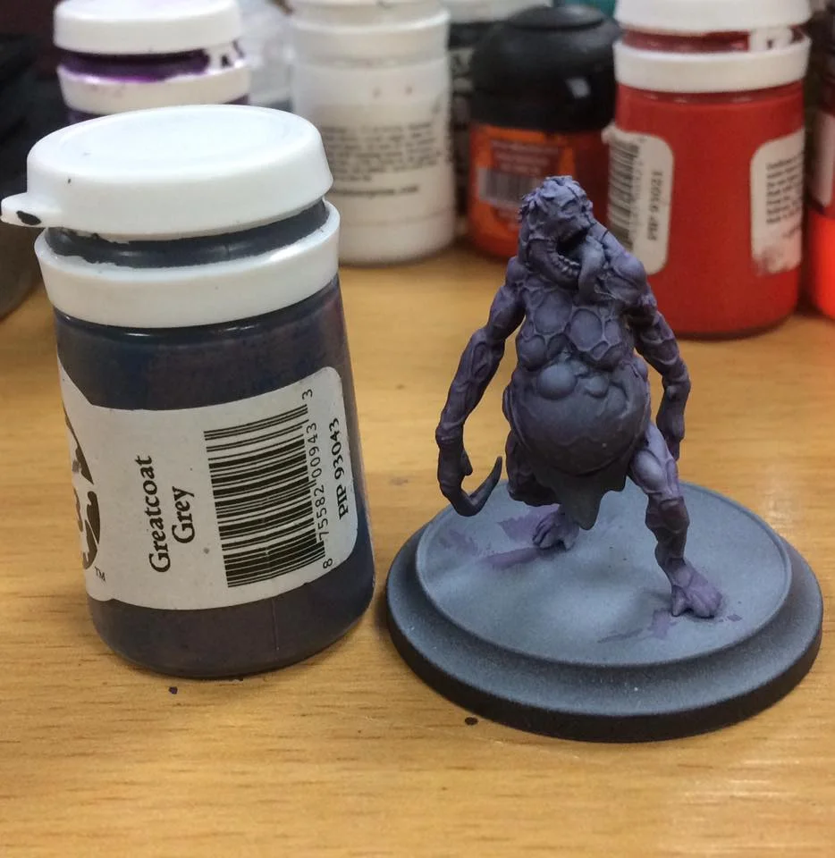 The basic skin areas are blocked in with grey. This is watered down 3-1 and feathered out towards the shadowed recesses.