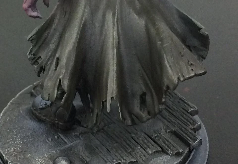 Mix up a 50/50 glaze (watered down 10-1) of Thamar Black and Umbral Umber and paint a thin layer over the whole area. Repeat this process three or four times, each time moving closer to the recesses.