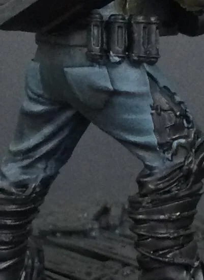 Menoth White Base is added to our Coal Black glaze and used as a very faint highlight across the raised areas. Incidentally, this is where I leave the process for denim…