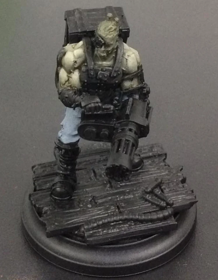 Menoth White Highlight is glazed over the top parts of the muscles. Try and get this to end sharply where the shadows and highlights meet to enhance contrast.