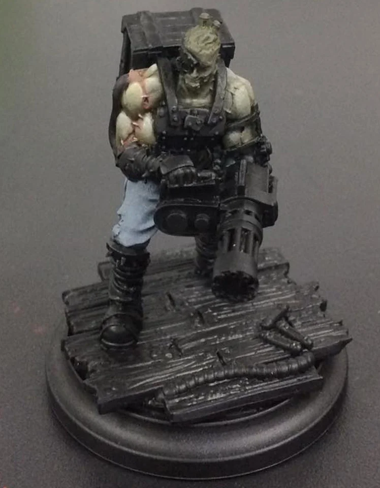 A 50/50 mix of Khador Red Base and Beaten Purple is glazed into and around the scars and stitches. This is repeated three time to add depth to the sore areas and then finally the stitching is picked out in Menoth White Highlight.