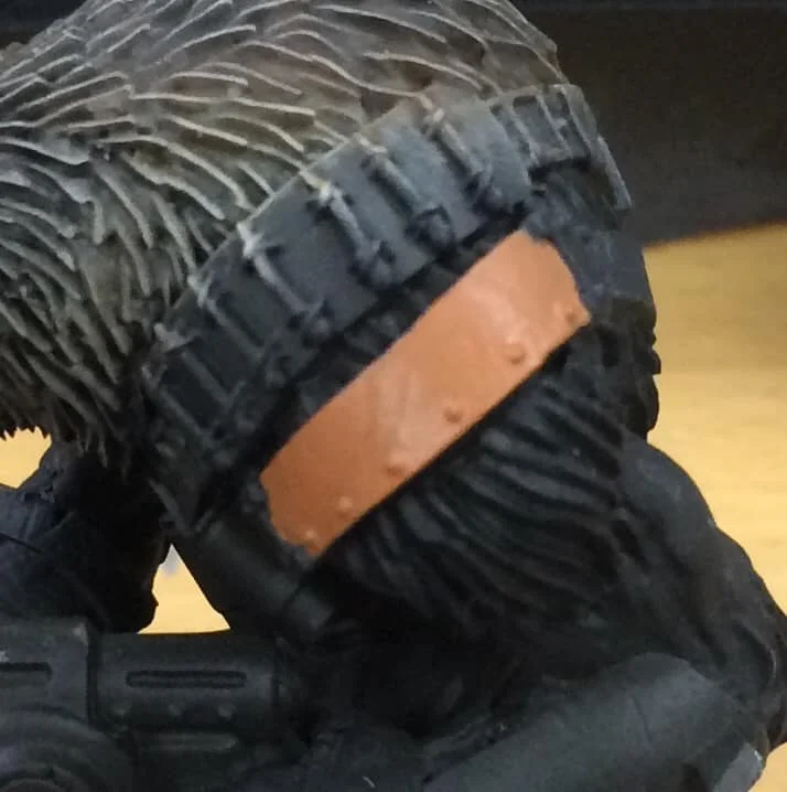 The area is basecoated 50/50 Khador Red Highlight/Idrian Flesh. Keep this mix wet as we'll be using it again later.