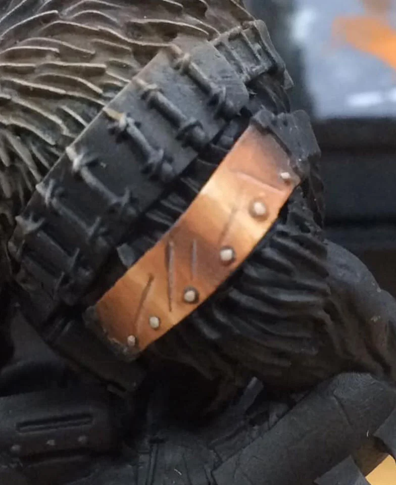 We go back to our earlier highlight mix and pick out the rivets and the edges of any damage.
