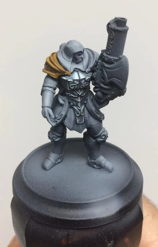 A wash of Brown Ink is applied across the whole shoulder pad to add separation and contrast - the key to fast NMM.