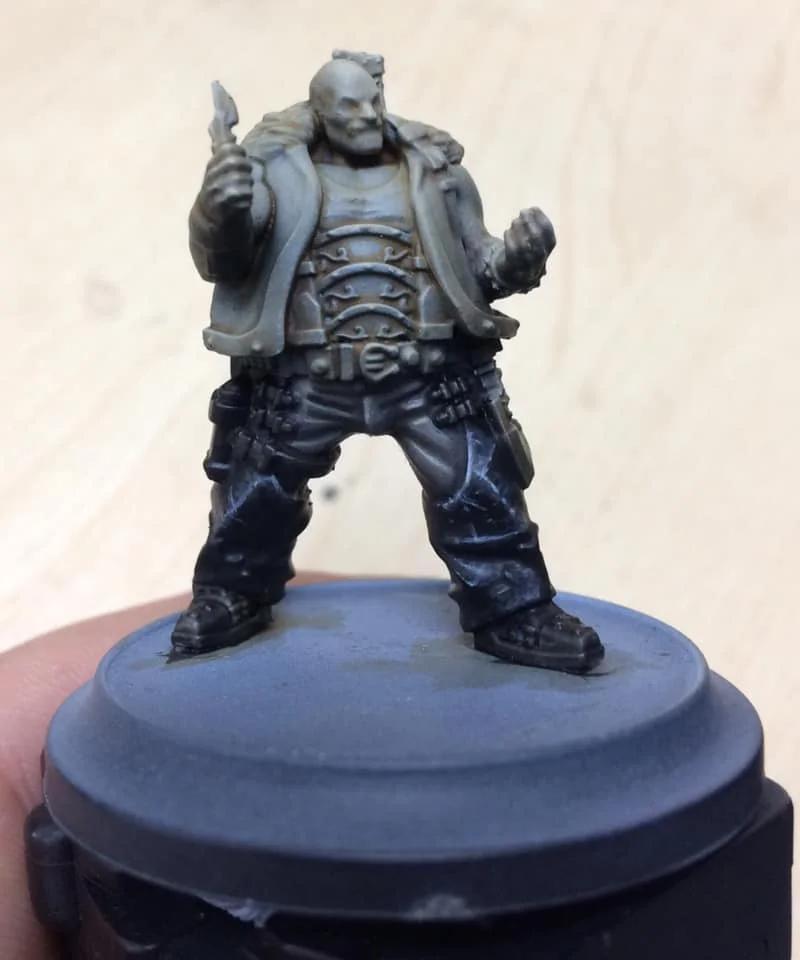 Step 5 - the folds and scratches are picked out in pure Menoth White Highlight with our 000 brush.