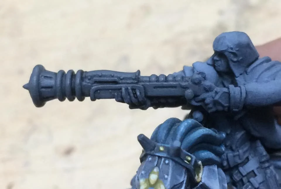 A thin wash (4 parts water to 1 part paint) of Thamar Black is applied and allowed to pool a little to give us some definition of our main shapes.