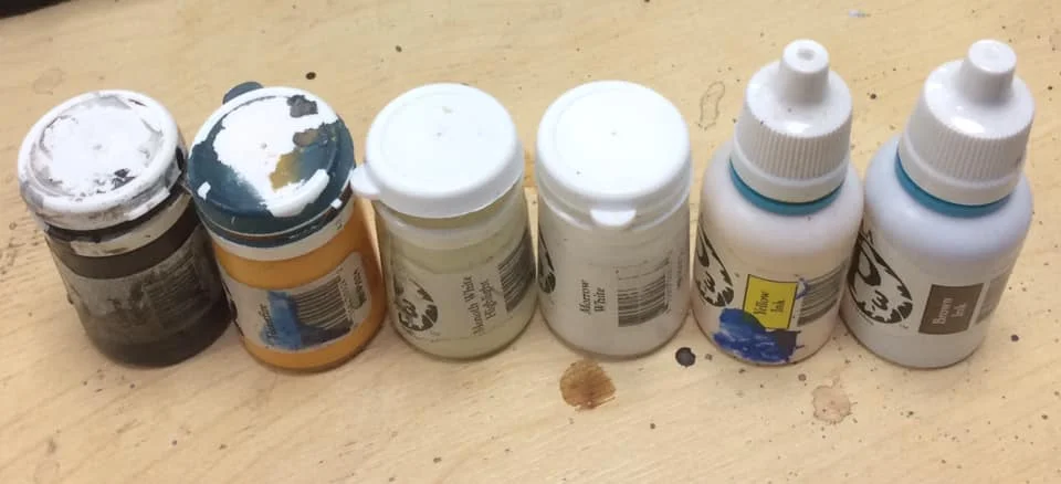 Colour comparison: deep Brown, golden yellow, pale bone, white, yellow ink and red/Brown ink.