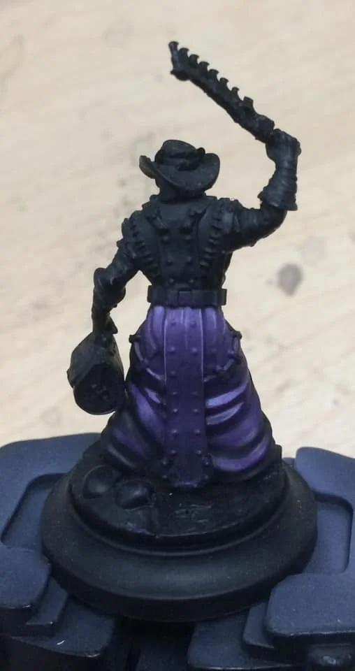 The third quarter up the robes was highlighted with 1:1:2 Beaten Purple, Menoth White Base and water.