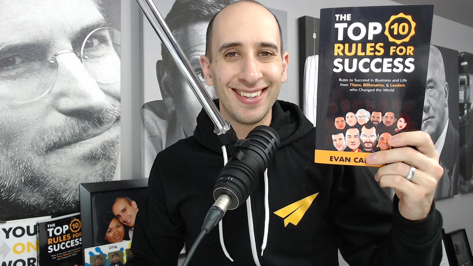 Evan holding Top 10 Rules book.jpg