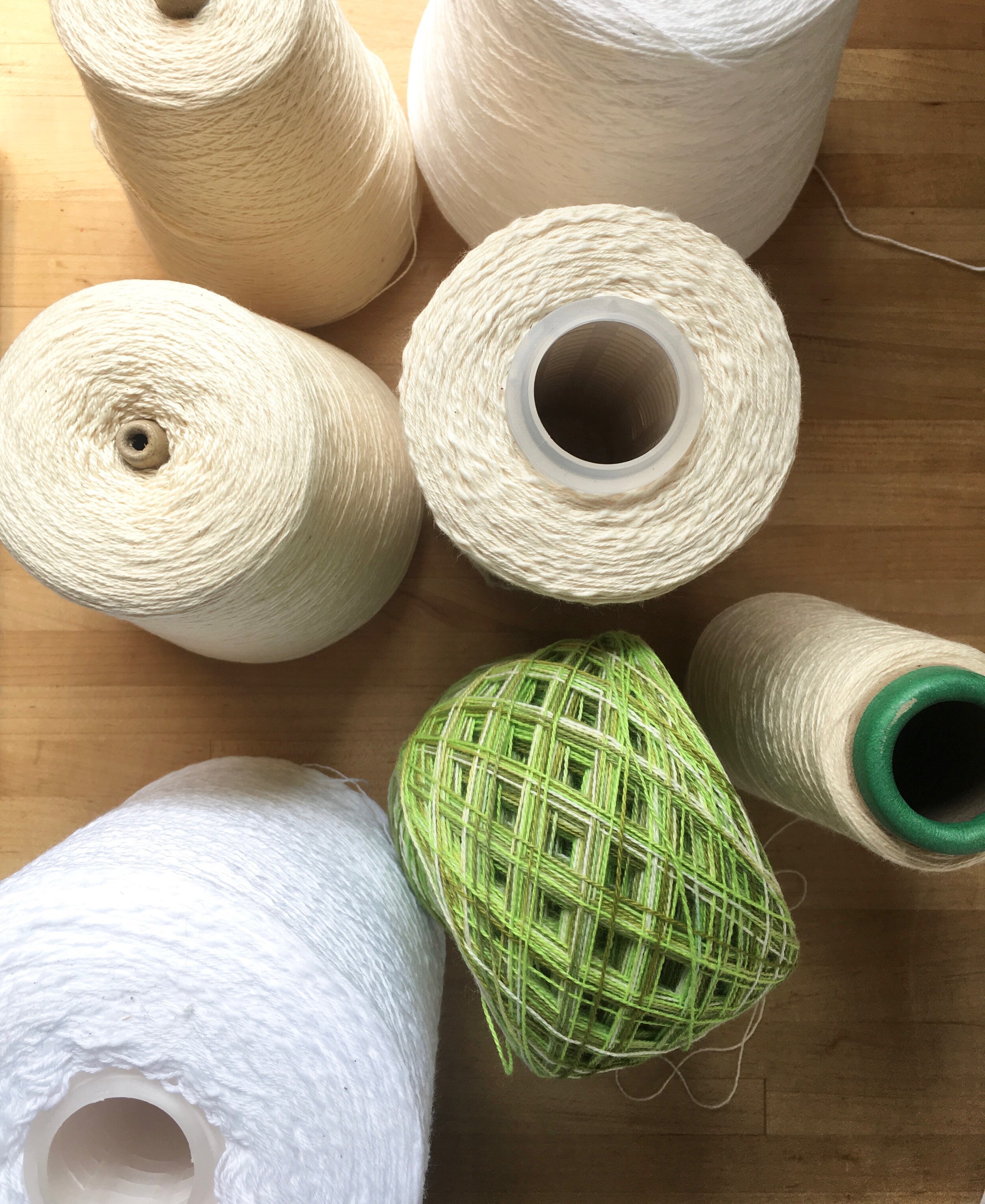 A collection of yarn on cones 