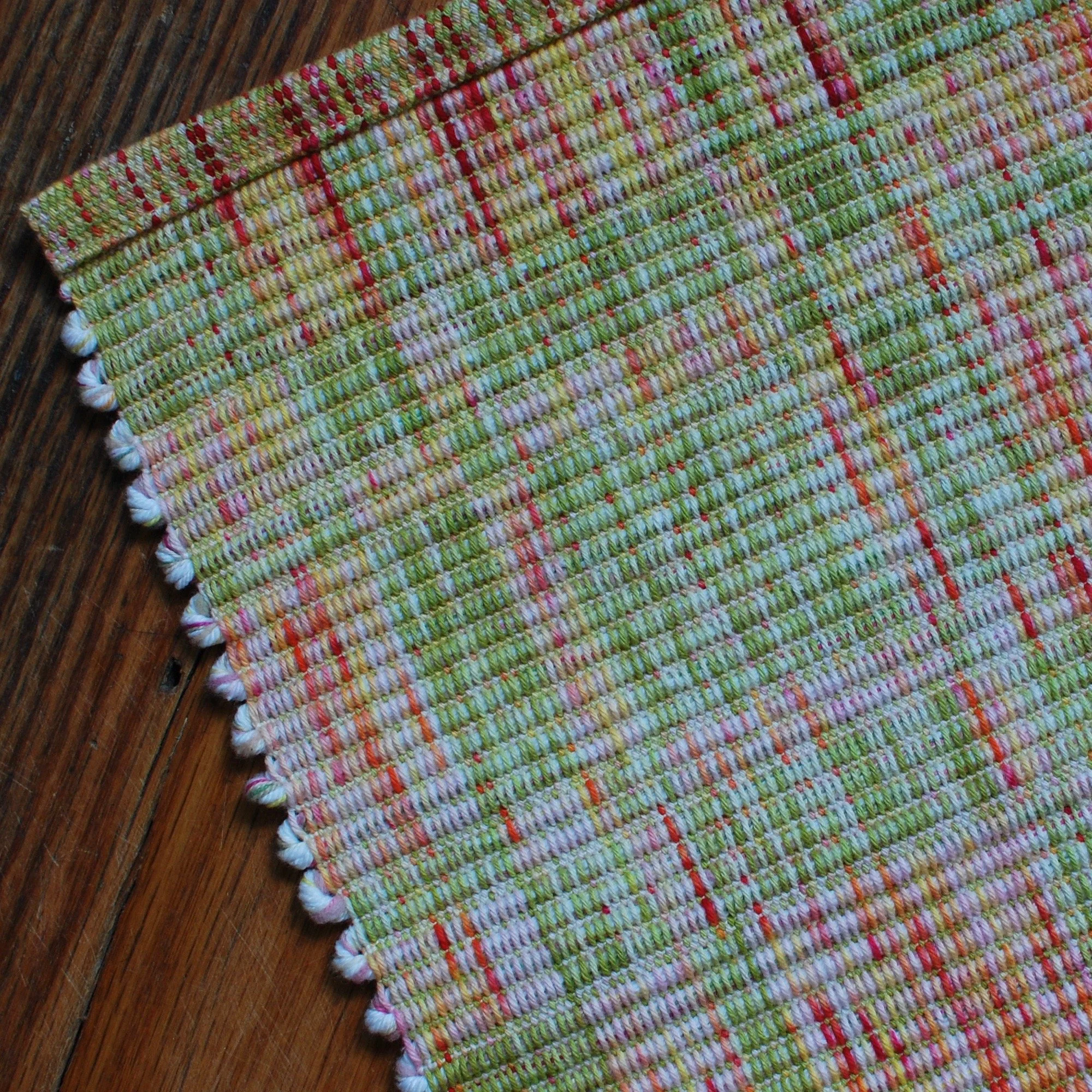 Color blocked corner of a one of a kind cheerful rug