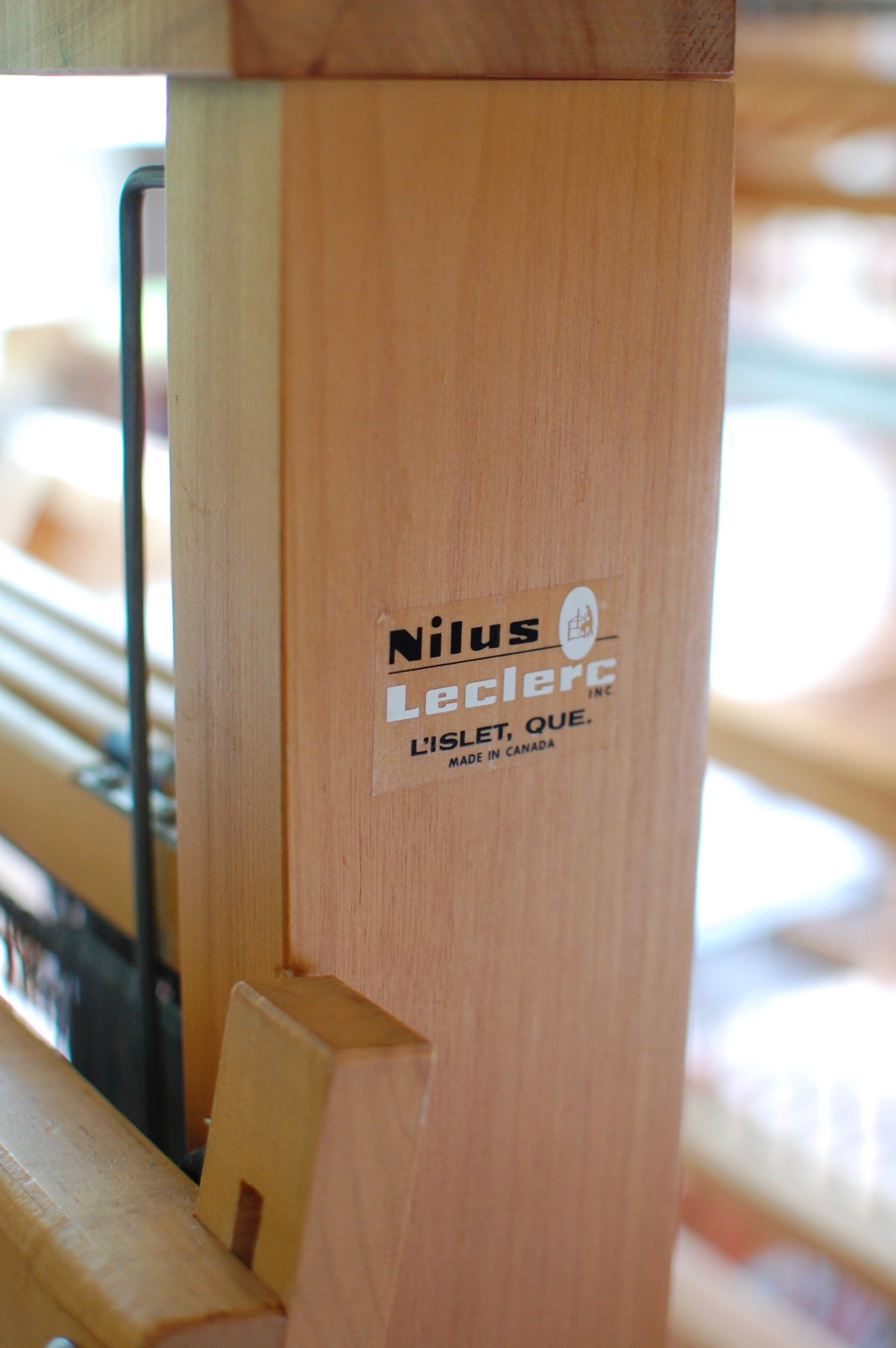 The Nilus LeClerc makers logo on the side of the loom