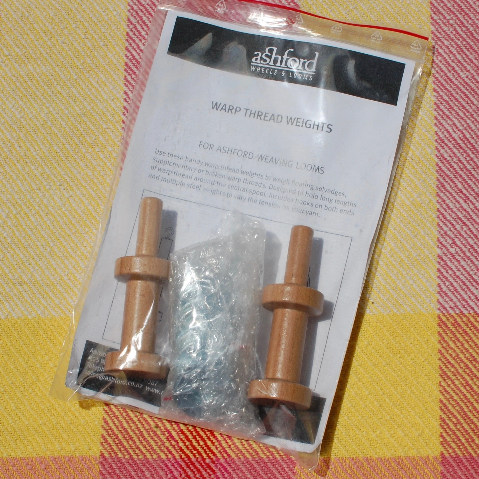 Set of Ashford warp thread weights.