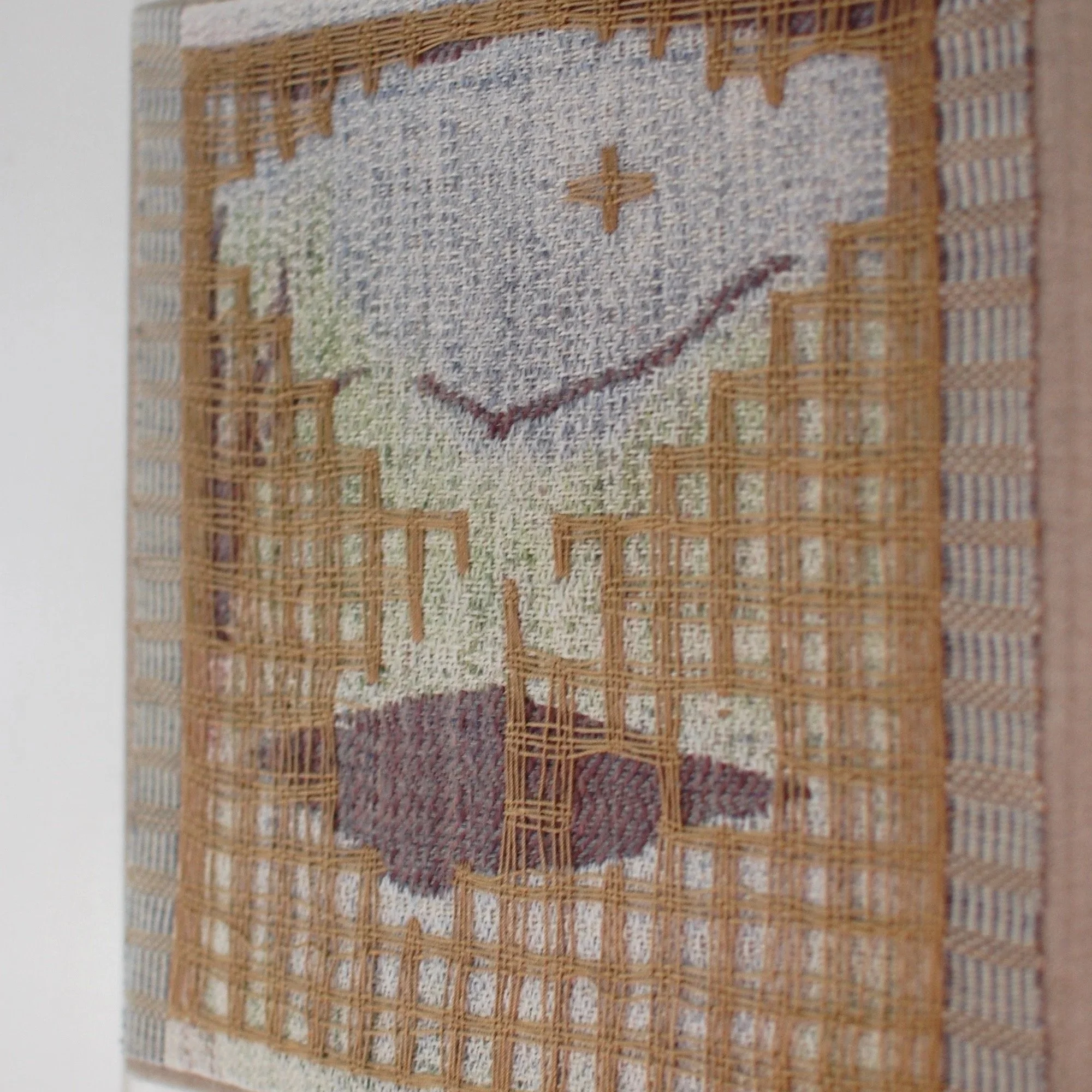 Detail of a handwoven piece of fiberart