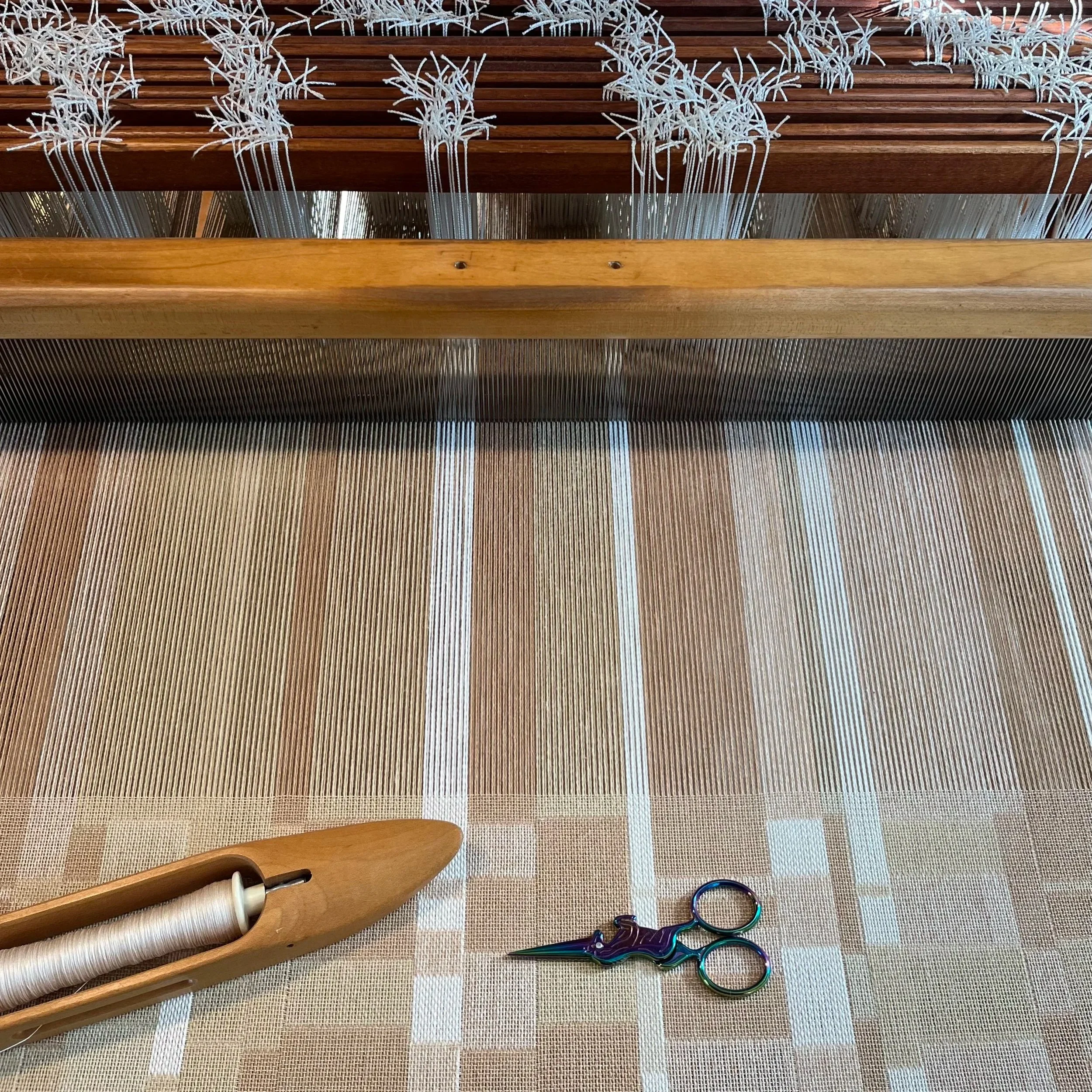 Double-weave textile being woven on an AVL loom. Custom interior design