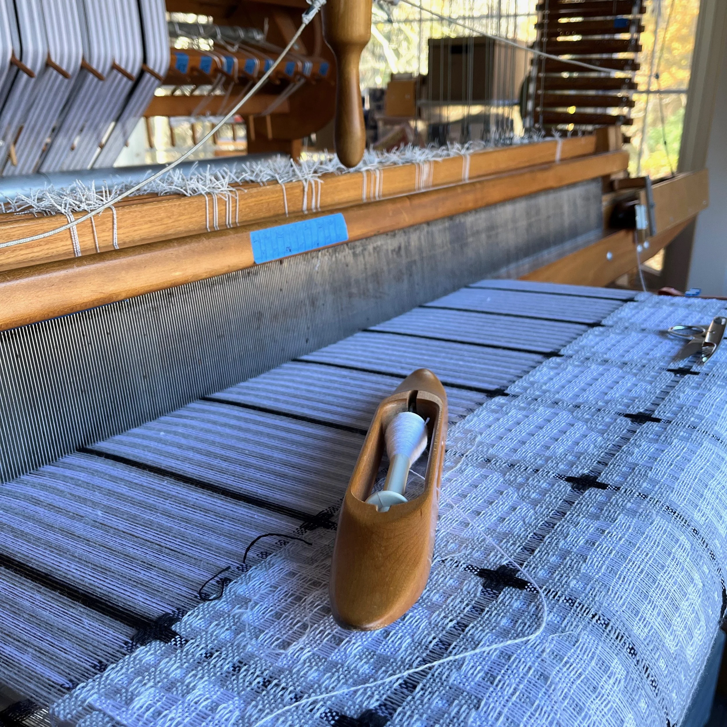 Merino cloth being woven on an AVL loom in a home studio in CT>