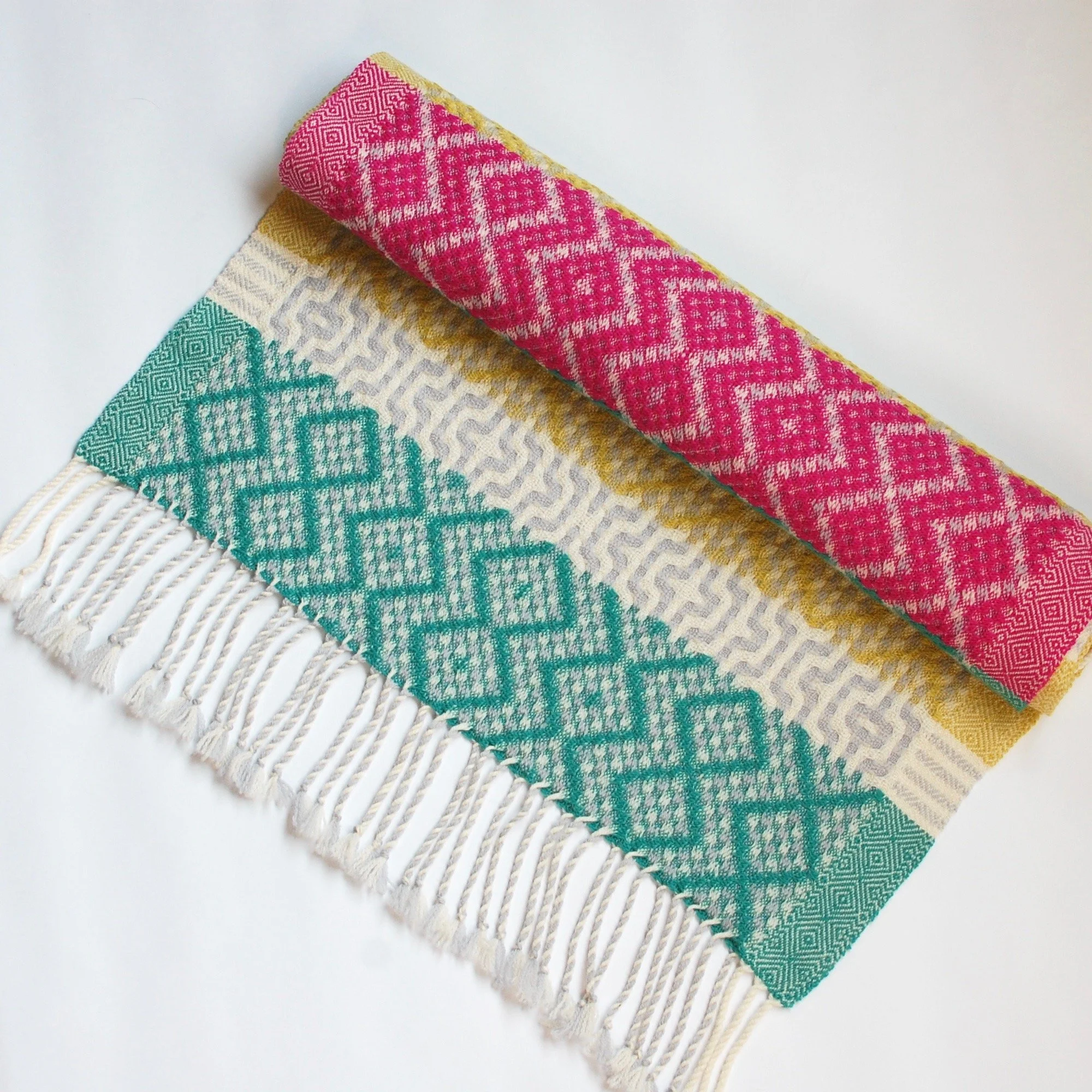 Handwoven blanket scarf with bright colors. Made in USA