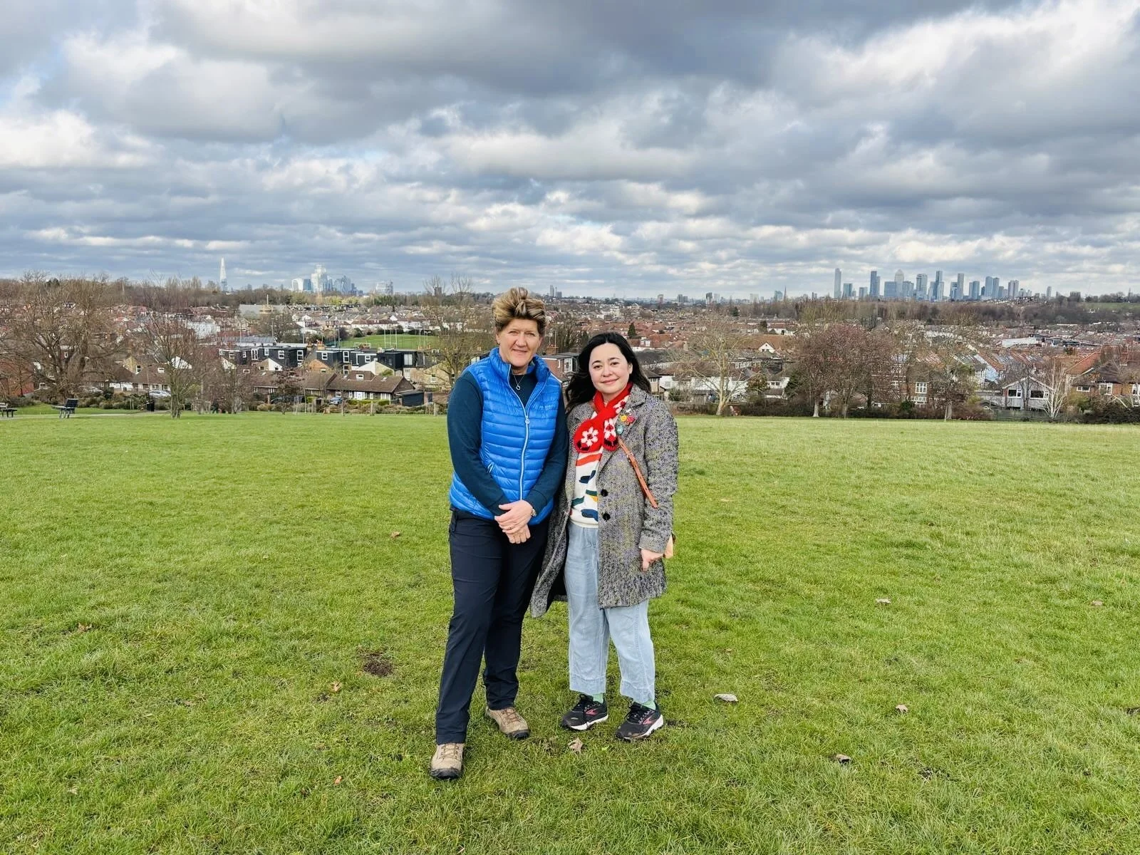 Clare Balding with Go Jauntly's Hana Sutch on Hilly Fields with the London city skyline in the background.