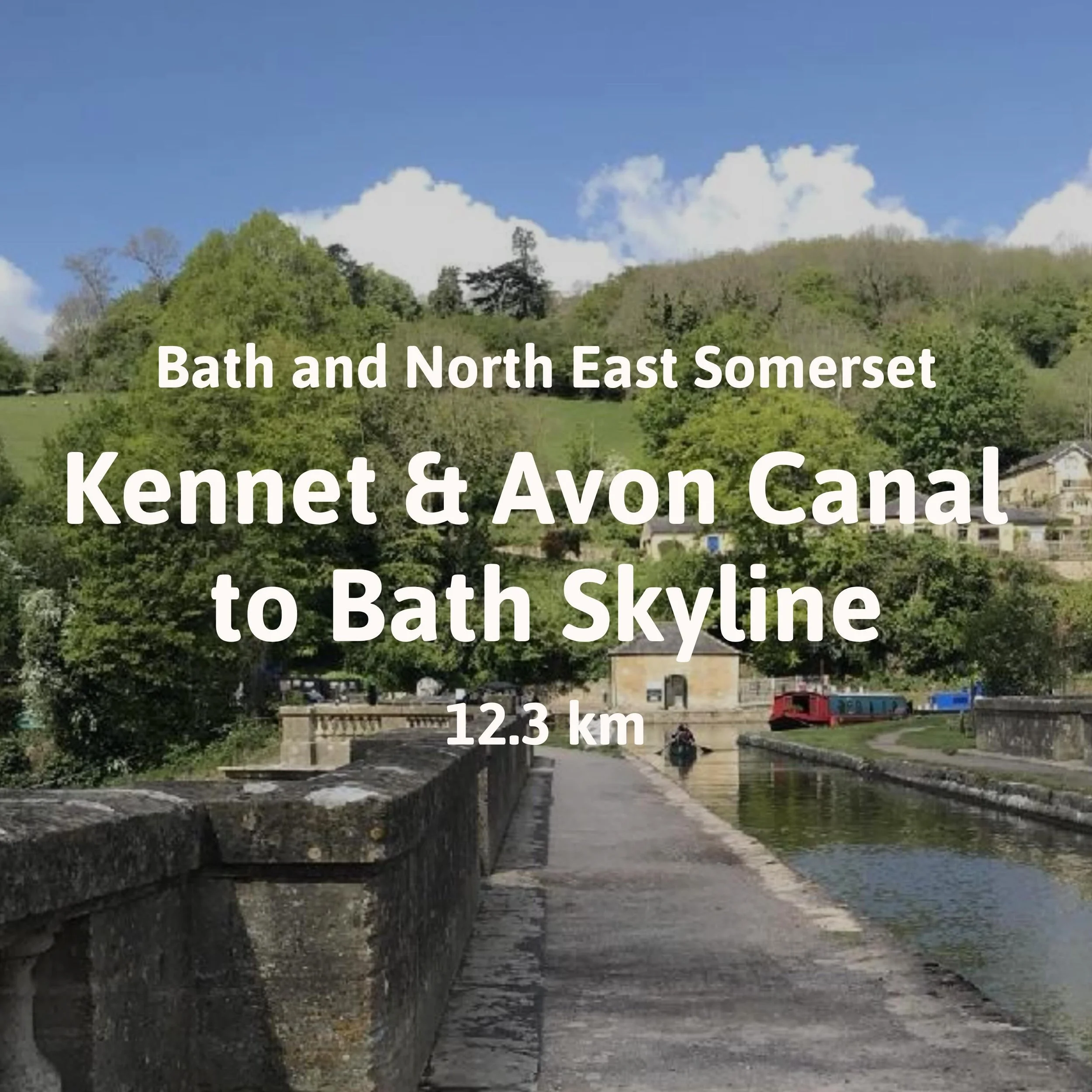 View across Dundas Aquedict along the Kennet and Avon canal with views of the green valley sides in the distance.