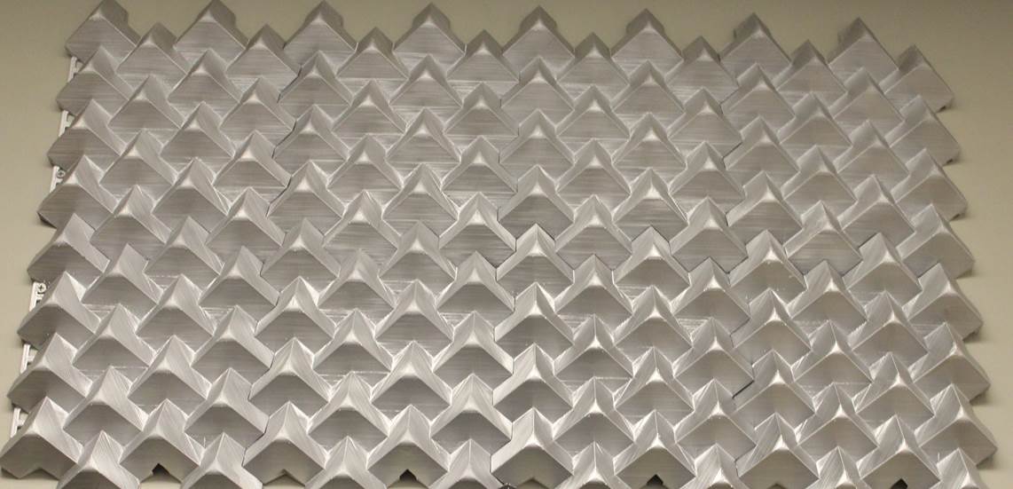 Figure 3. 4 x 2 array of 3D architectural tiles created using an equilateral triangle truncating object with a 30 ° truncation rotation