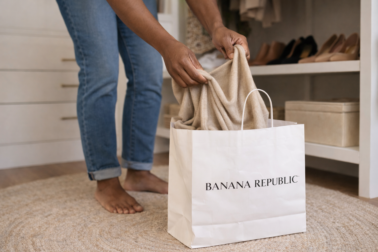 Woman wearing jeans in closet , sorting through clothes