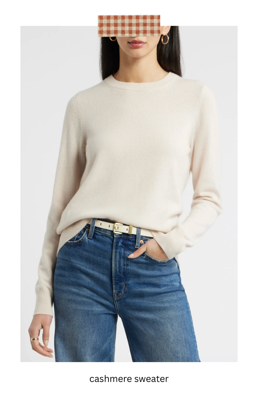Women wearing an ivory cashmere sweater with jeans.
