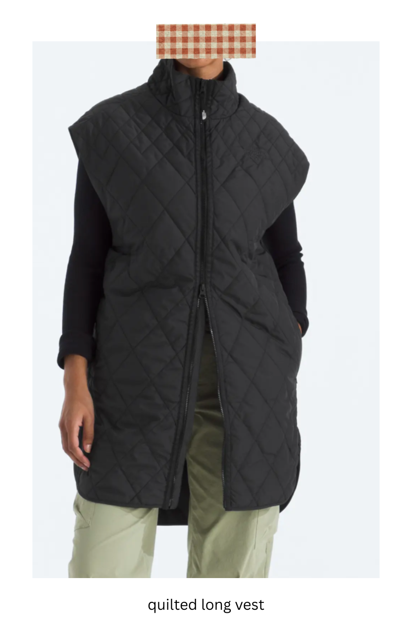 Woman wearing a black quilted long vest.