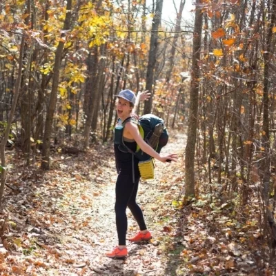 Varina backpacking on the Appalachian Trail in Shenandoah National Park, wearing trail shoes .