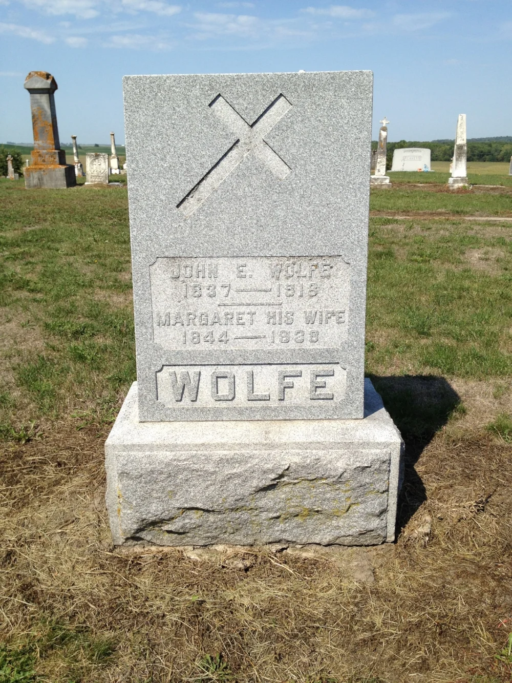 Gravestone of John E. Wolfe, Saint James Cemetery, Toronto, Iowa