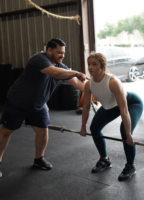 Archon coach working with athlete