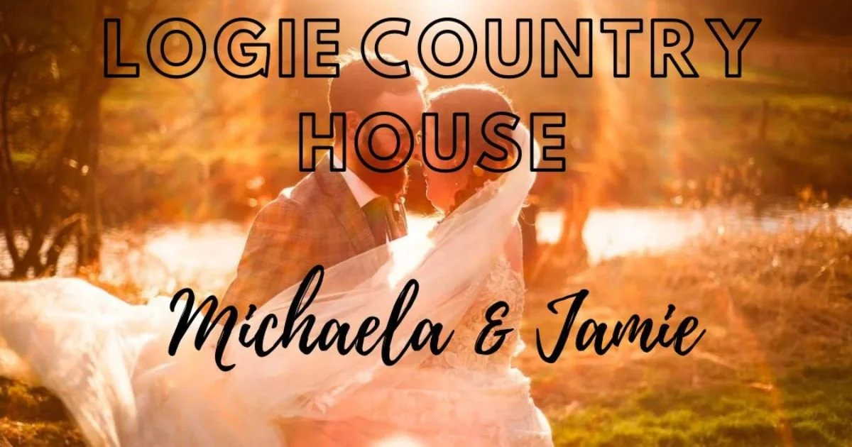 Romantic and artistic image of a wedding couple embracing on the grounds of Logie Country House, the Wedding venue in the north of Scotland. It is a bright, backlit image with lots of creative sun flare.