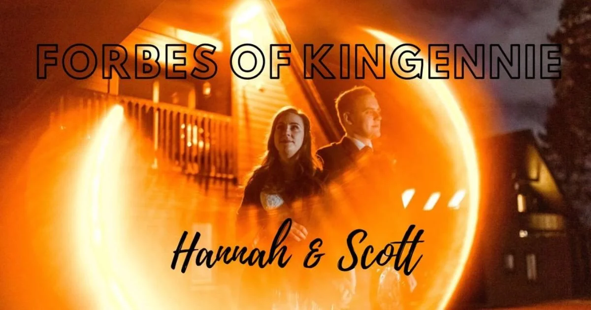 artistic and creative image of bride and groom stood together with Forbes of Kingennie Wedding venue in the background. A light flare envelops the couple in an abstract manner