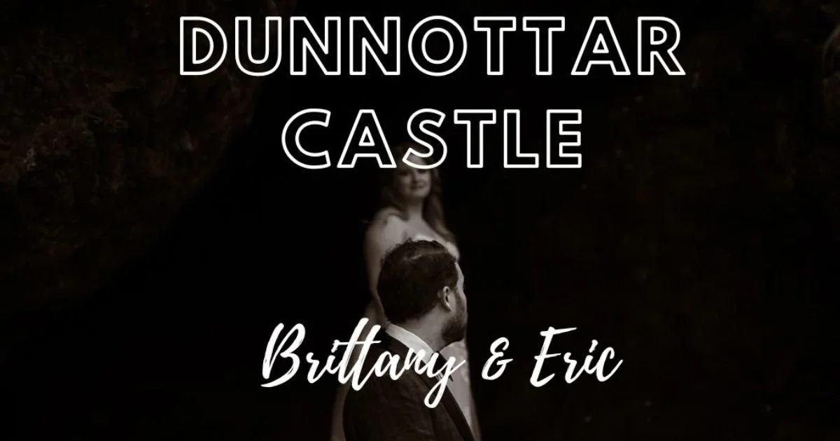 moody and atmospheric of bride and groom looking at eachother in the dark cliffs at the foot of Dunnottar Castle.jpg