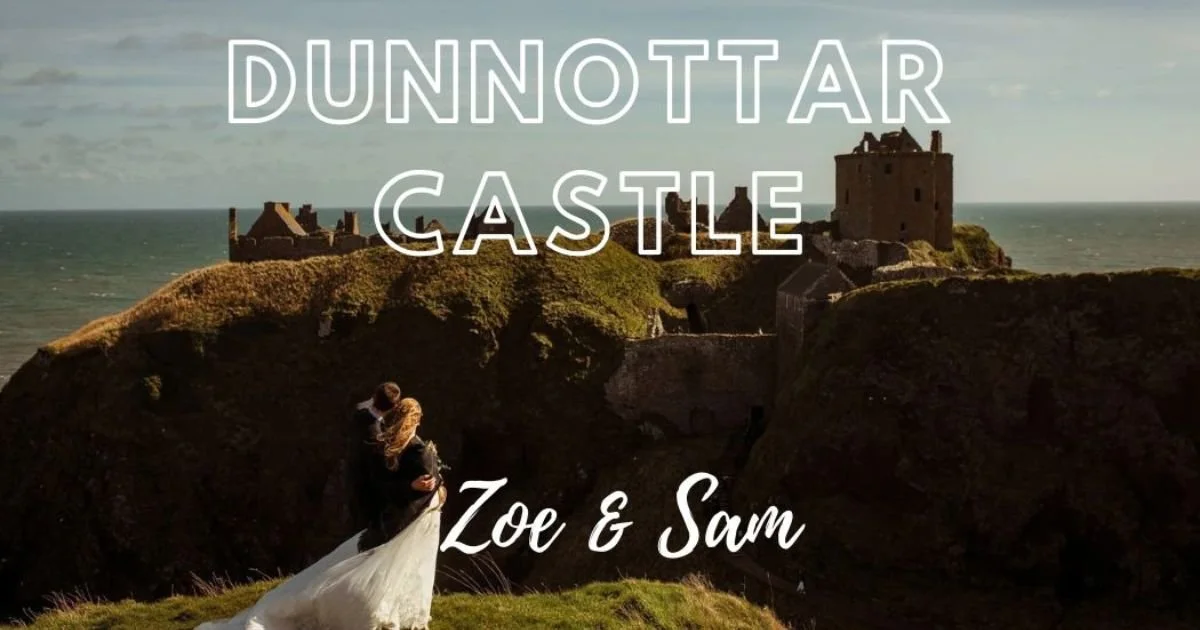 Romantic and wind-swept image of a newly married couple looking out onto Dunnottar Castle Wedding venue from the cliffs adjacent to it.