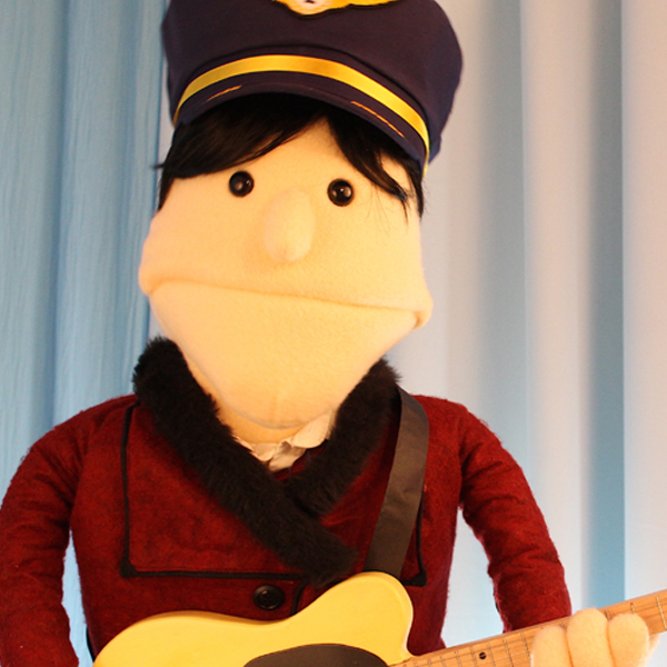 Sings + Plays Guitar