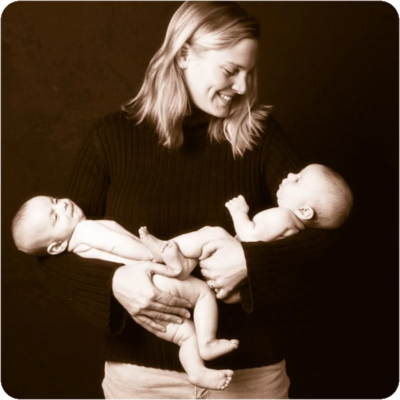 ABC Doula owner, Kimberly Bepler, holding twin babies. Kimberly hires and is available to mentor each contractor personally. She takes great pride in the team that ABC has built.