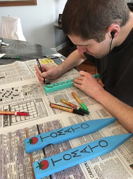 Robby creating the stakes.JPG
