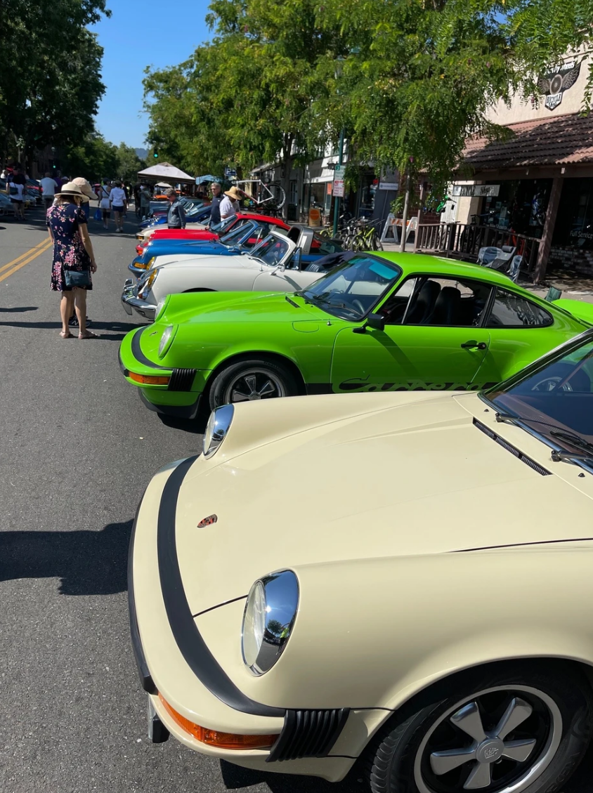 Porsches on main street view.png