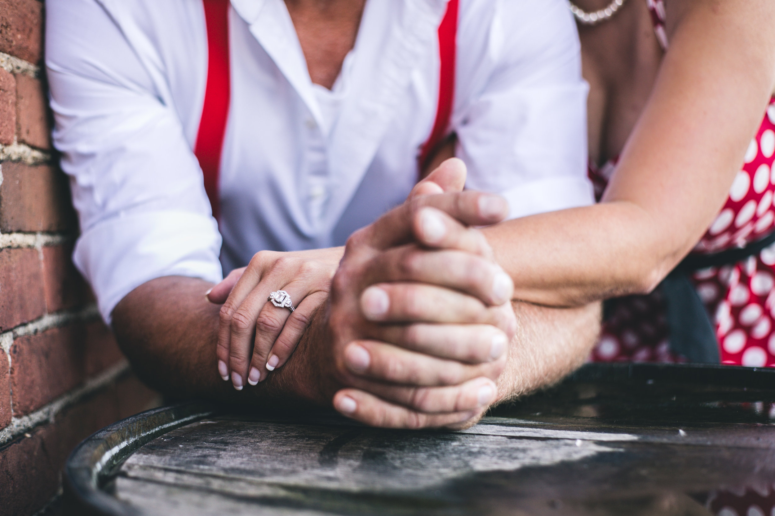 Couple holding hands engaged in Stillwater MN