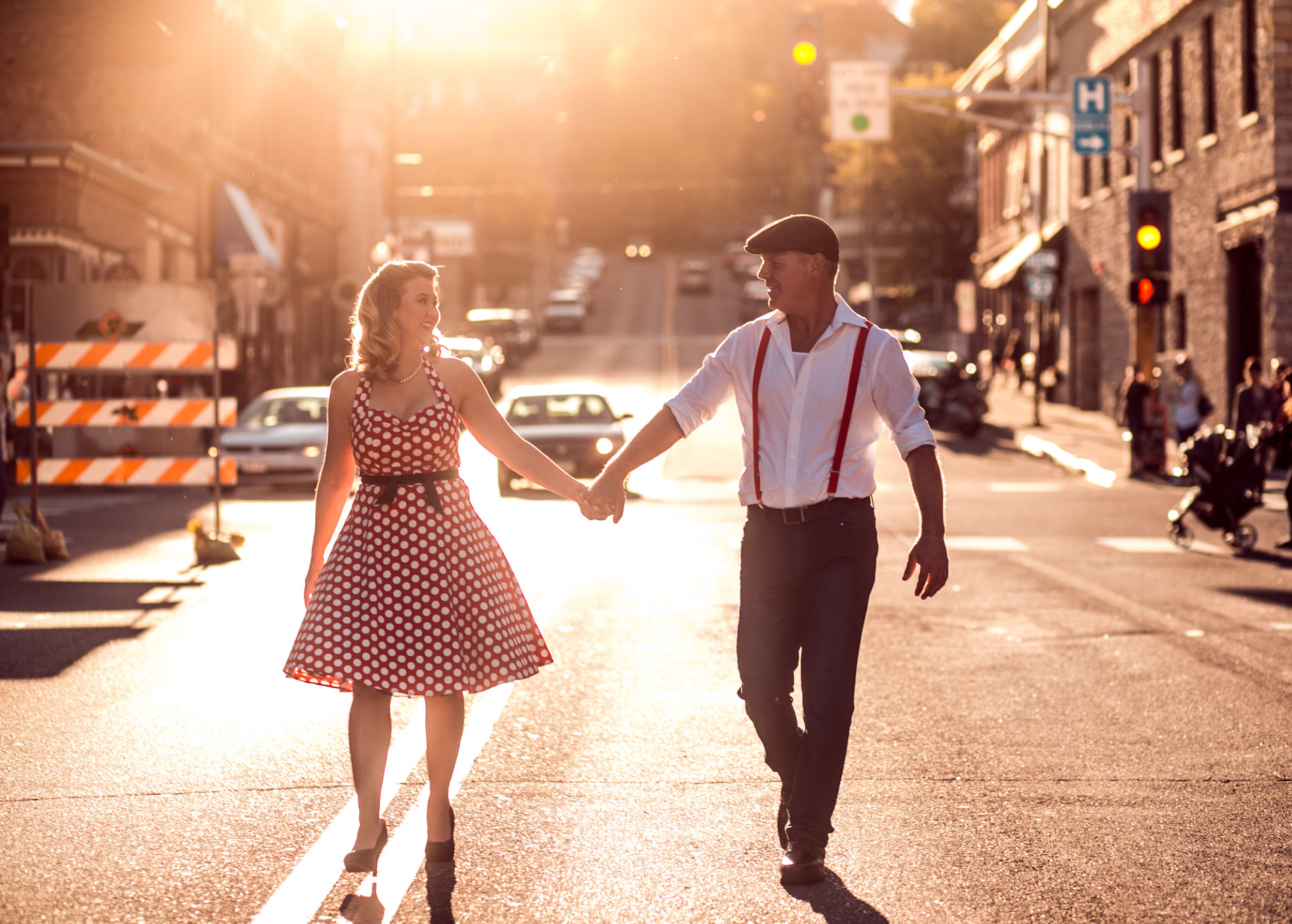 A couple dances in the golden light sunset in Stillwater MN street