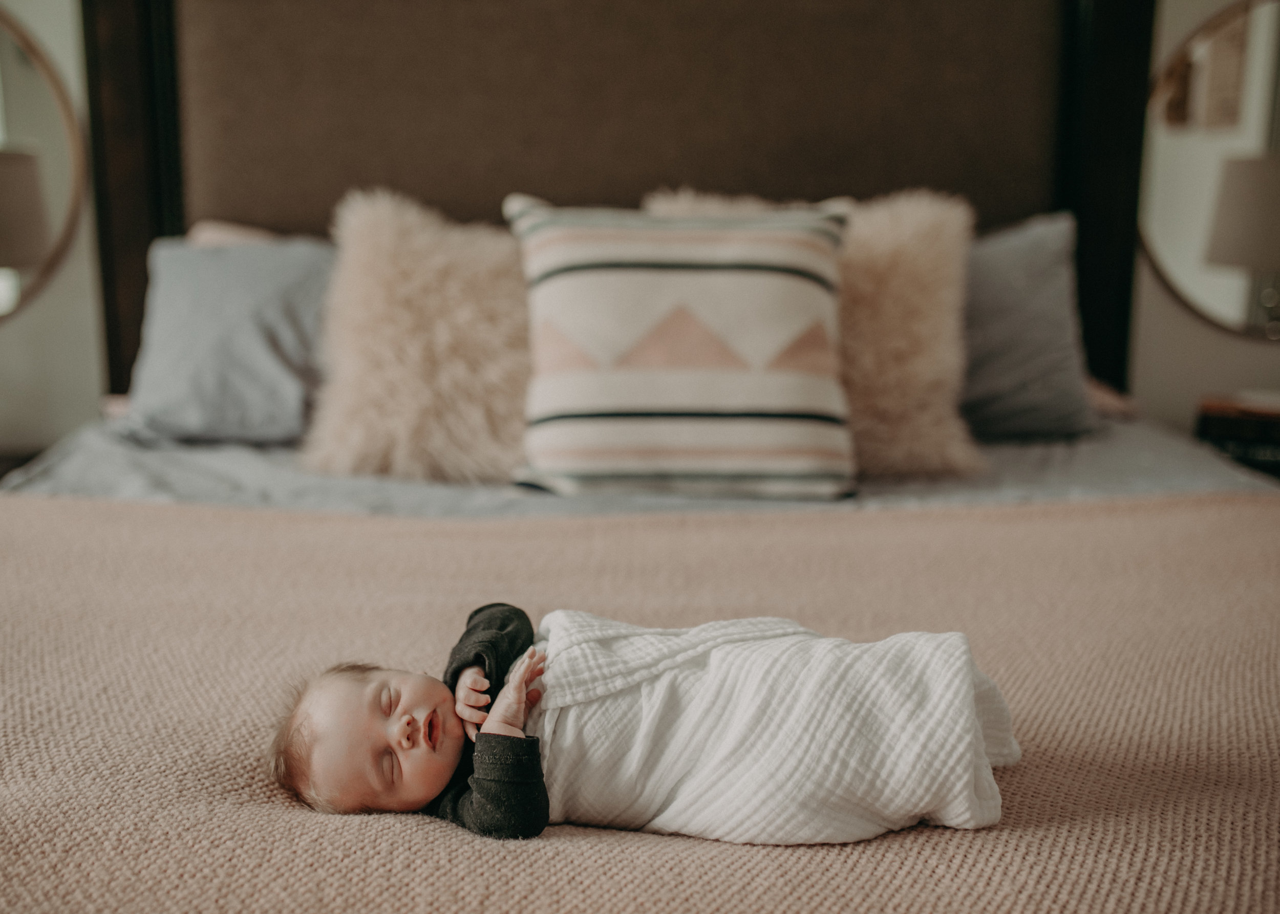river falls wi baby boy on bed in lifestyle newborn photoshoot