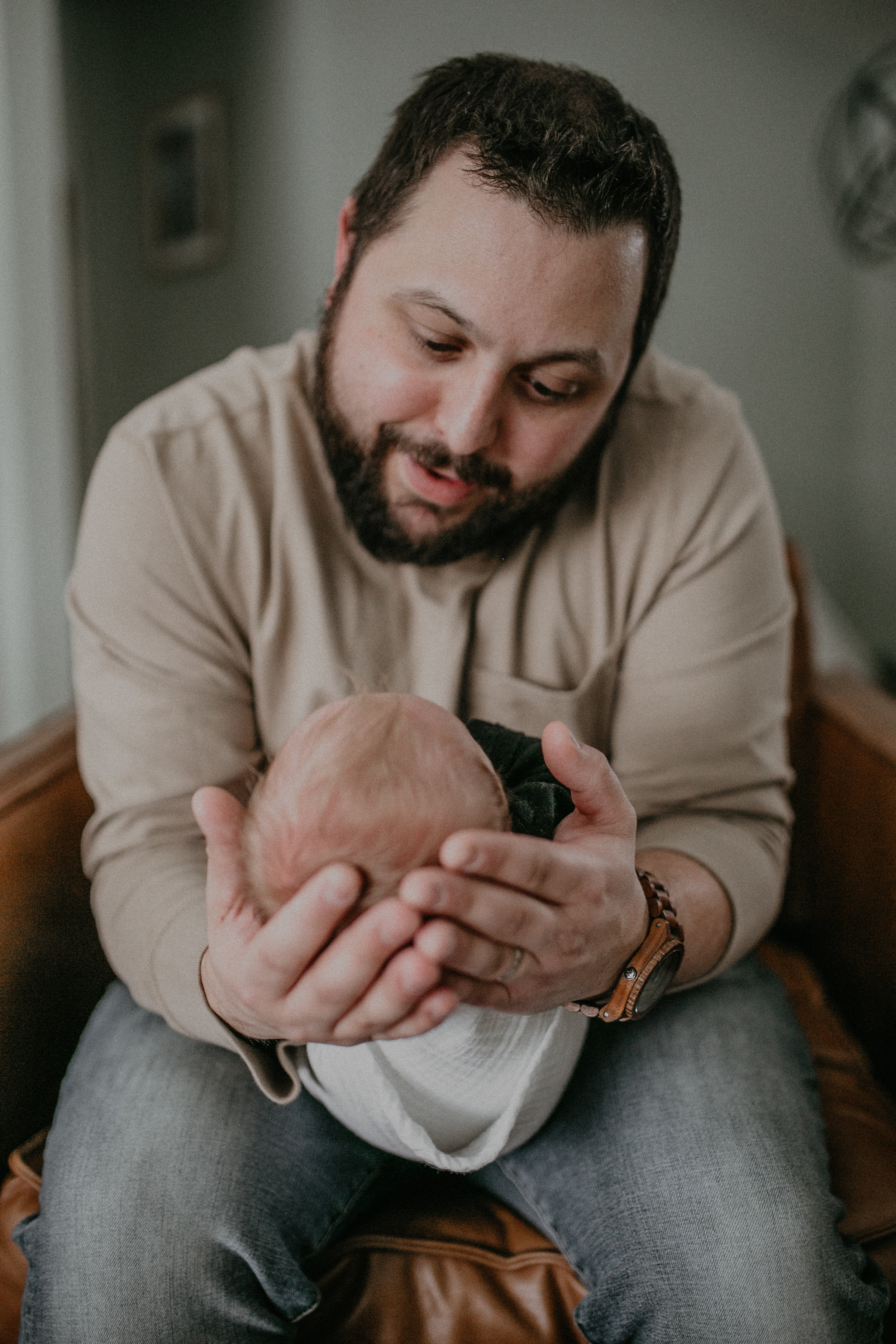 river falls dad holding baby son lifestyle newborn photo
