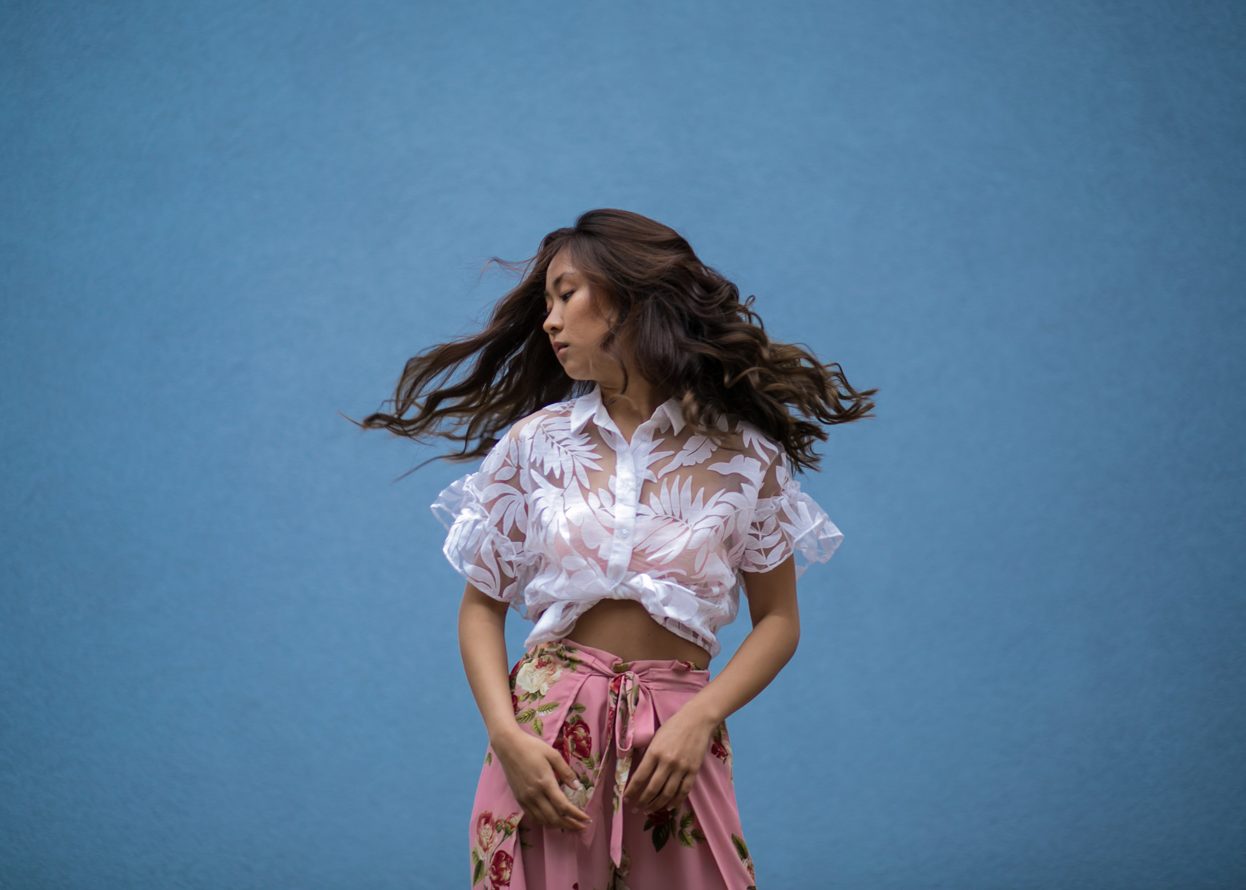 hair-flip-blue-wall