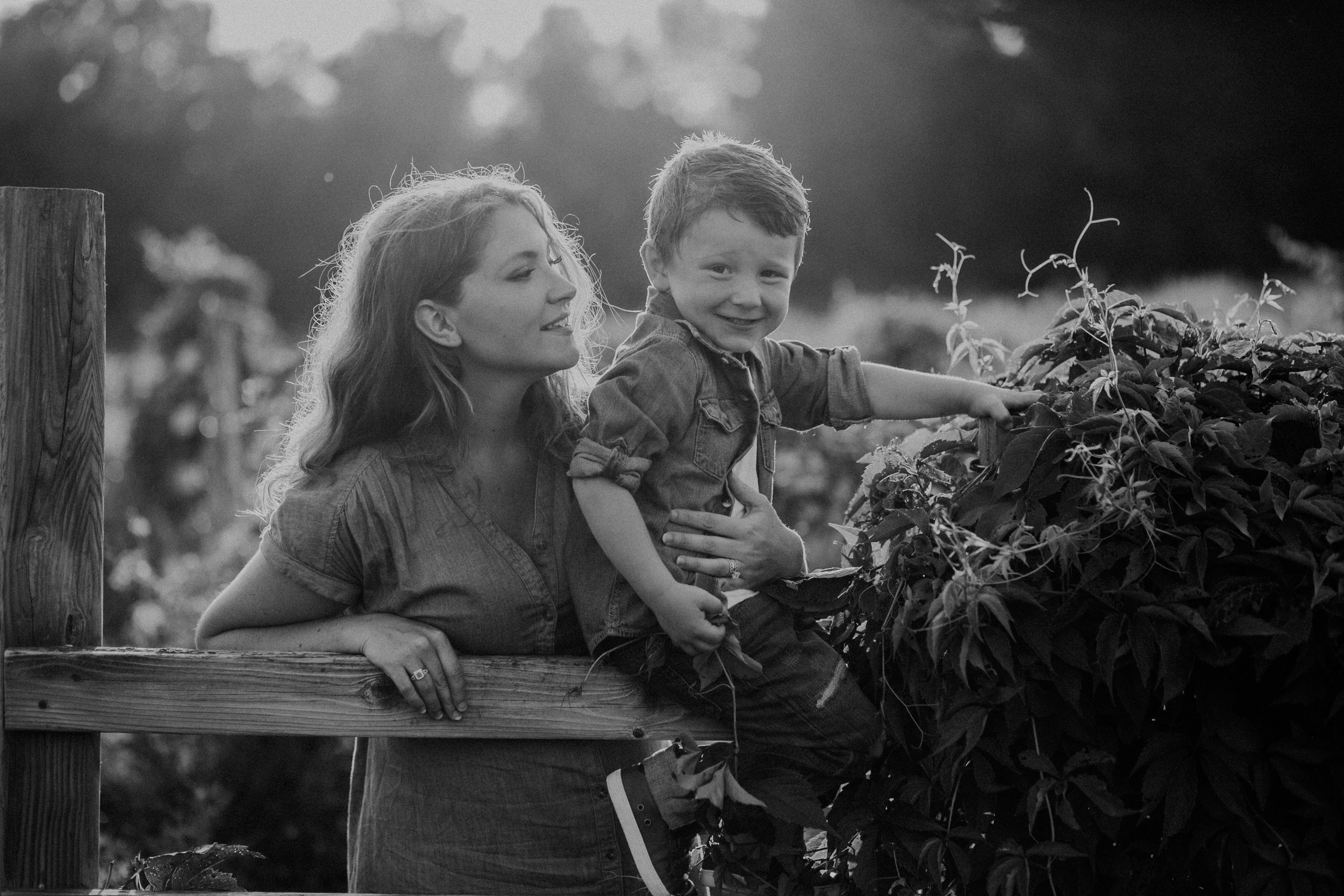 black and white lifestyle image of mom and son in River Falls