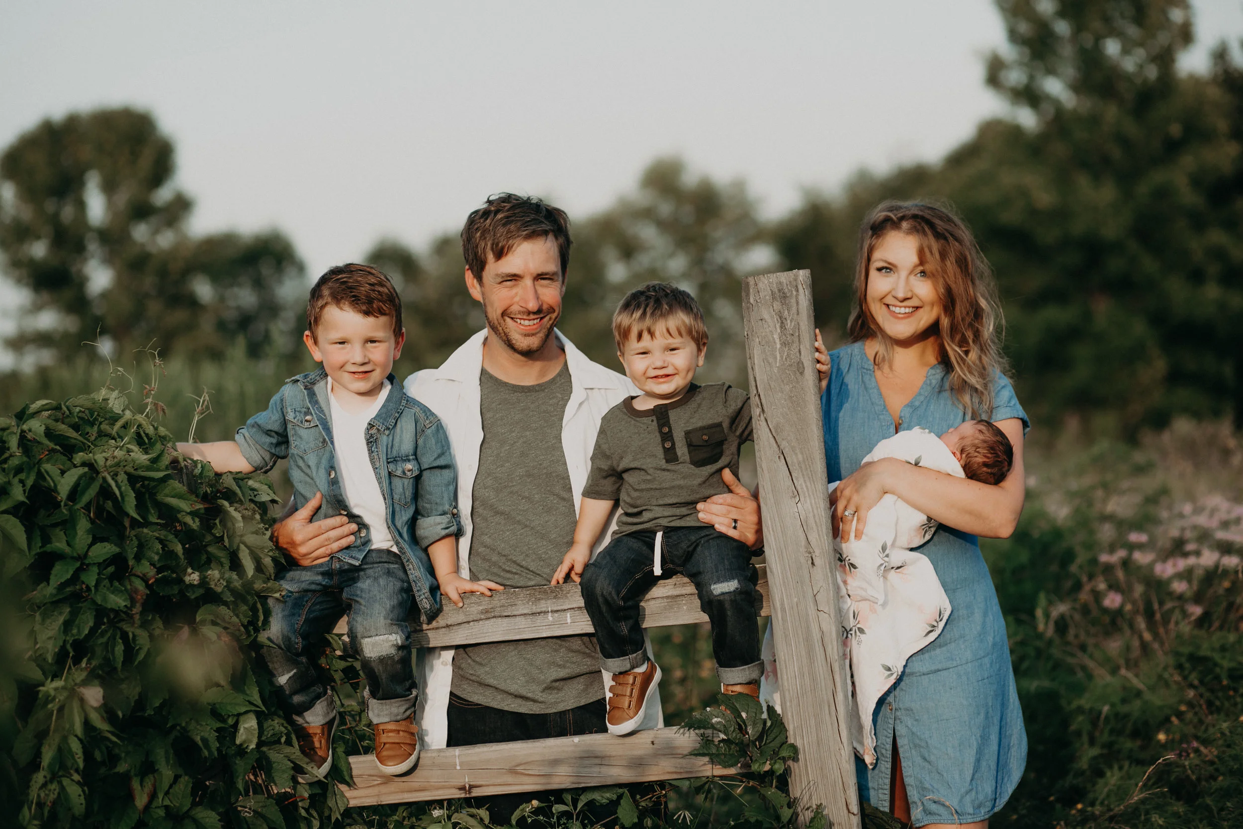 River Falls Wisconsin family portrait at sunset in field