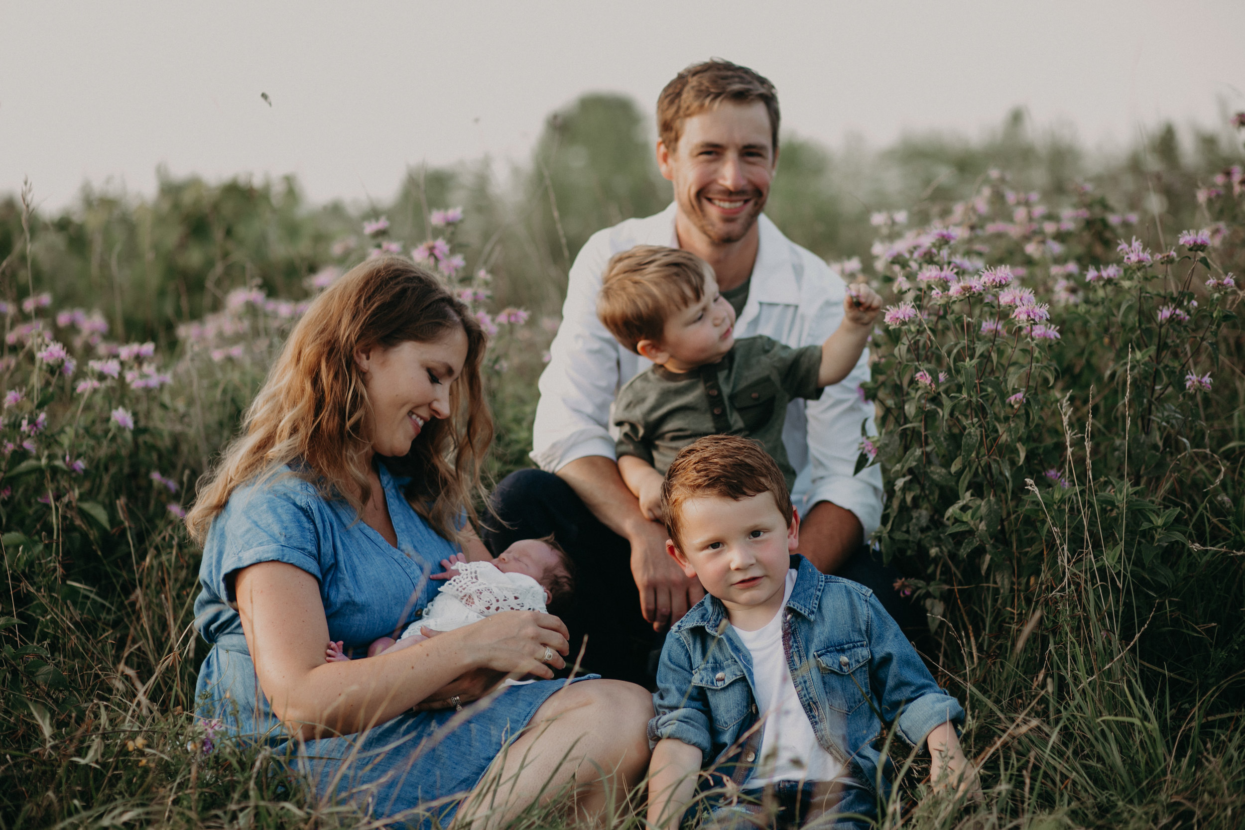 River Falls family in field of flowers