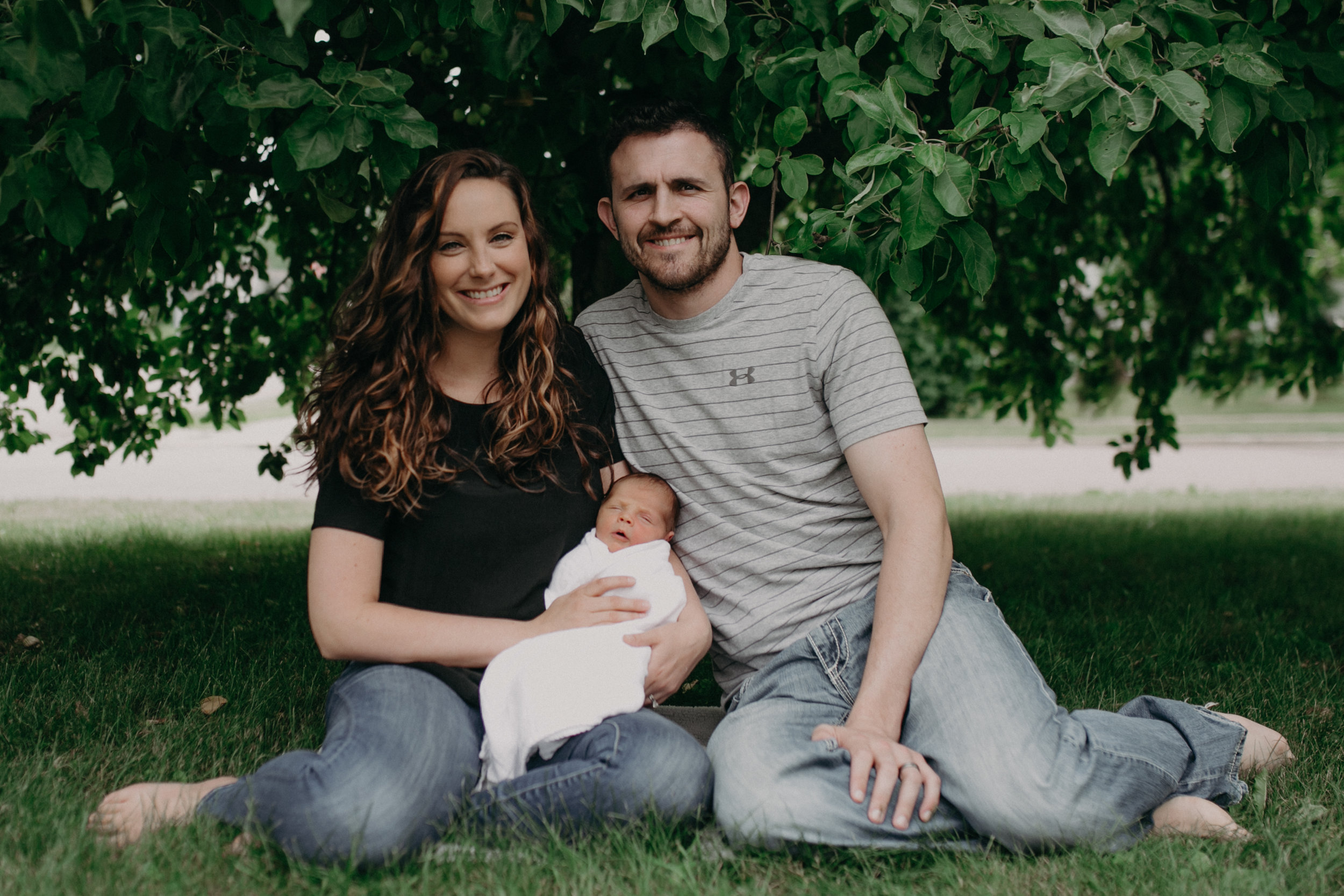  Marshfield WI family underneath tree taking pictures with newborn baby 