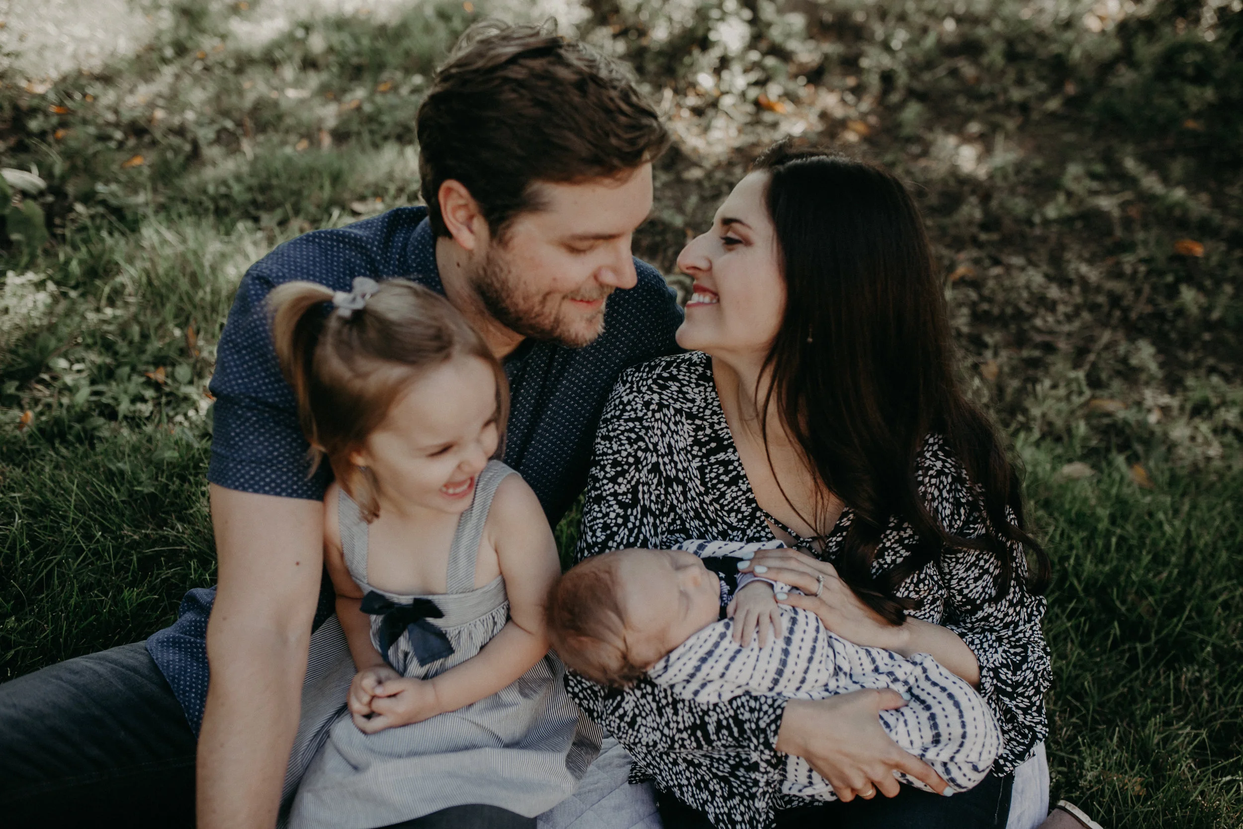 loving family in Wausau Wisconsin for a lifestyle in home session in the backyard